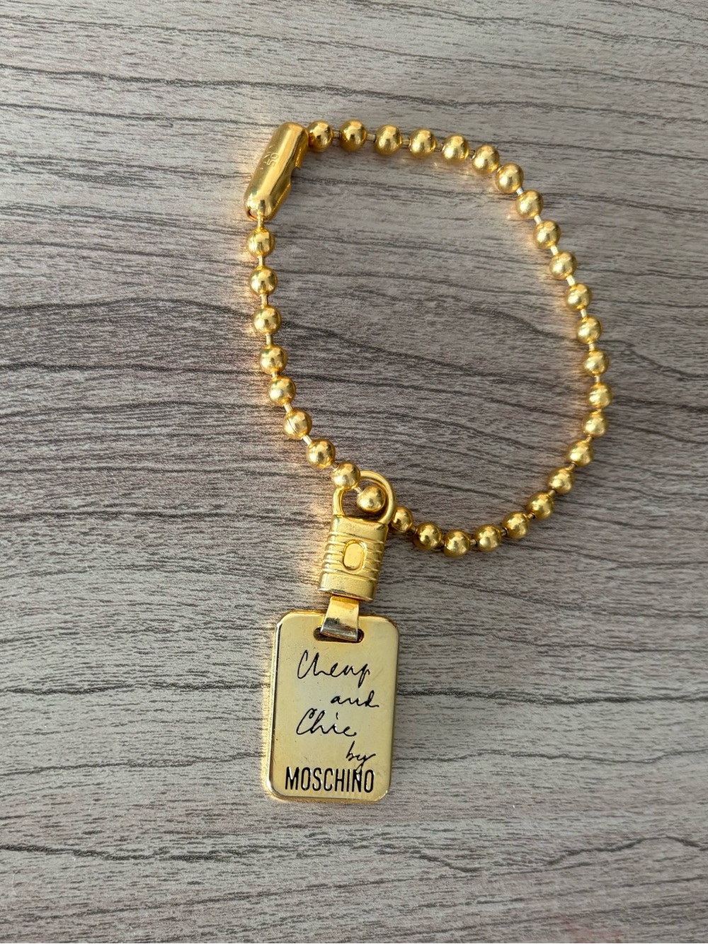 Moschino Gold Ball-Chain Bracelet with 'Cheap and Chic' Charm